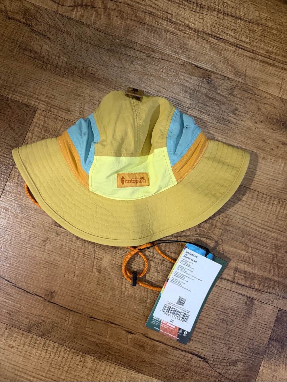 cotopaxi womens Yellow Bucket Sun Hat with Blue and Orange Accents